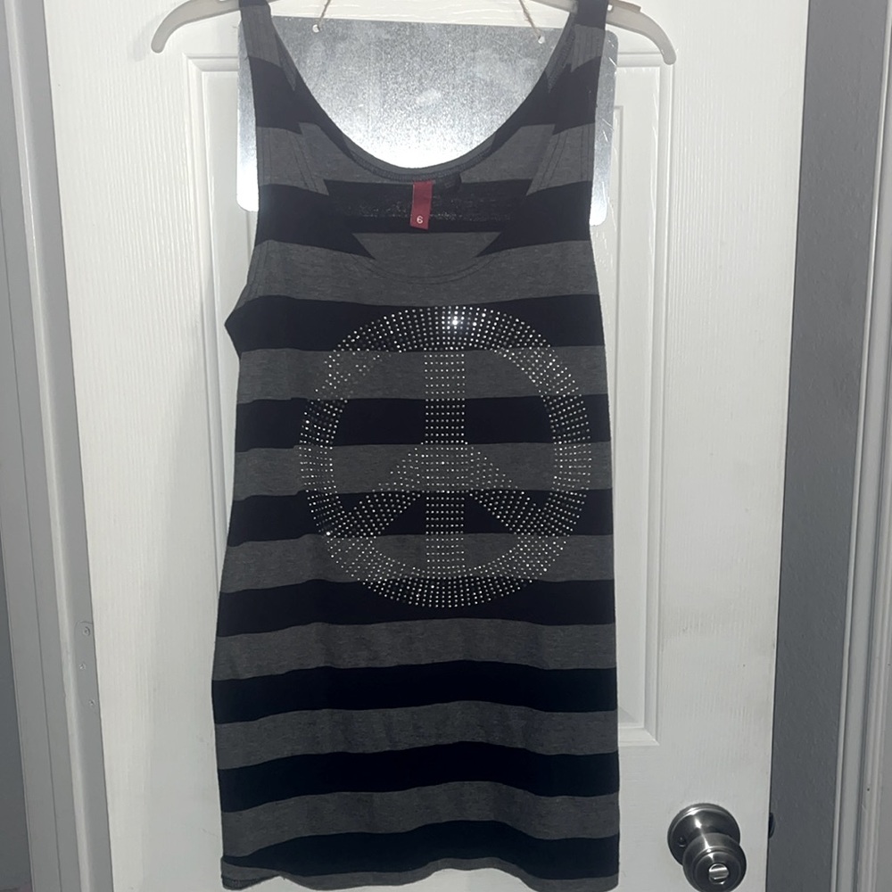 Size 6 juniors tank top, gray and black striped with bedazzled piece sign